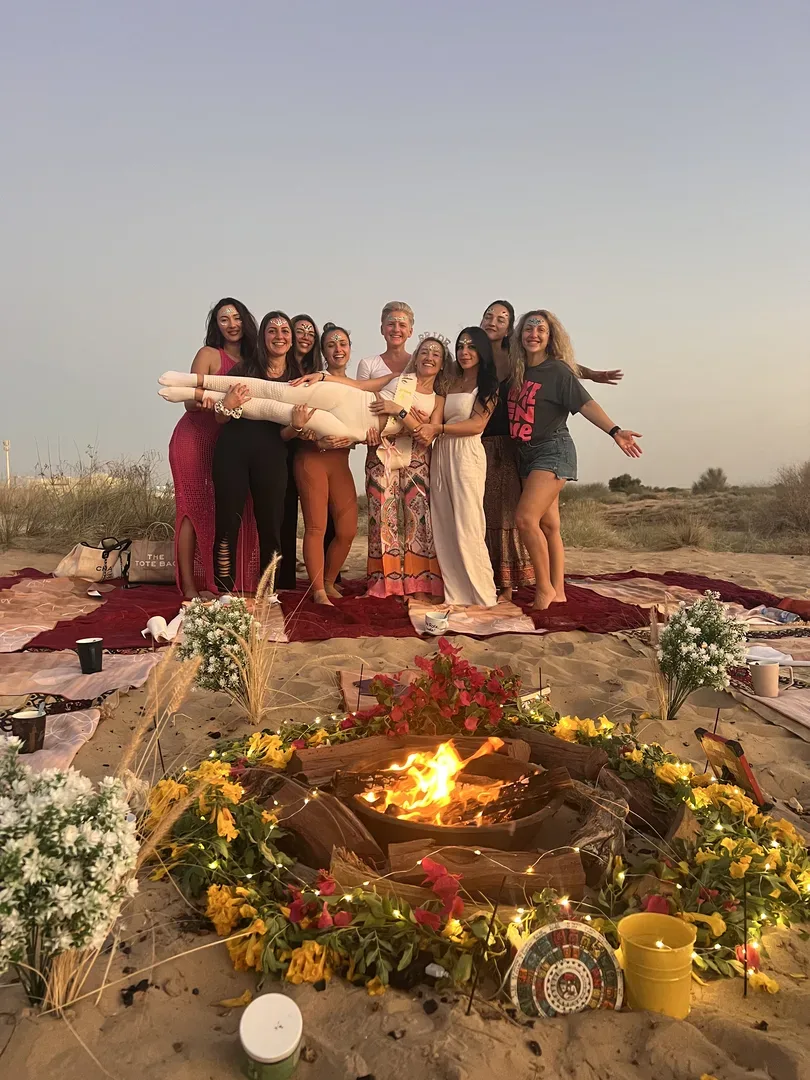 Szilvia Timar leading a sunset circle in the Dubai desert