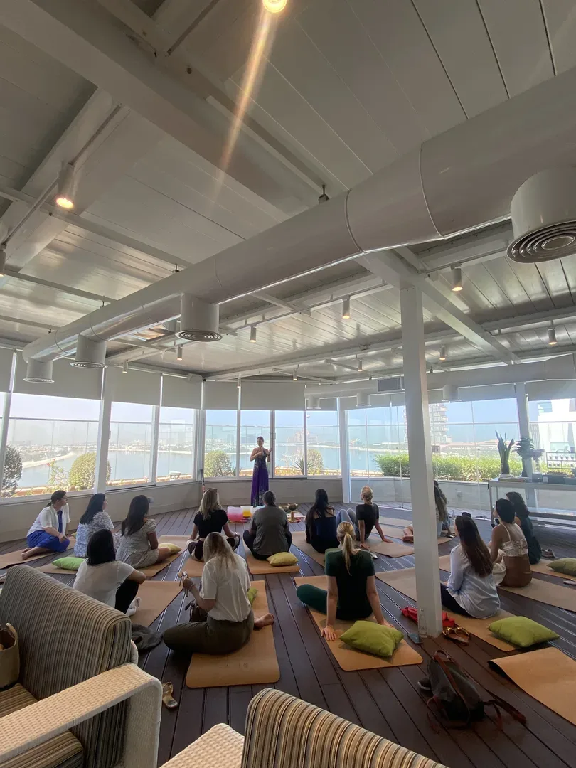 Szilvia Timar leading a rooftop yoga session in Dubai